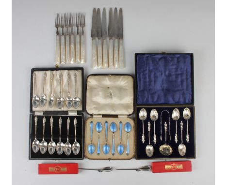 A set of six late Victorian silver teaspoons with apostle finials and scalloped bowls, and matching pair of sugar tongs and s