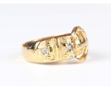 An 18ct gold and diamond ring in a buckle and strap design, mounted with two variously cut diamonds, Chester 1912, weight 3.2