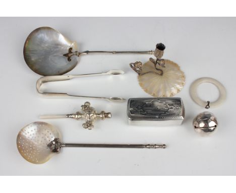 A 19th century Continental silver rectangular snuff box, length 8.7cm, a silver child's rattle with mother-of-pearl handle, a