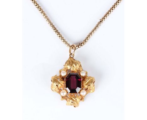 A gold, garnet and half-pearl pendant, mounted with the octagonal step cut garnet at the centre, otherwise set with four half