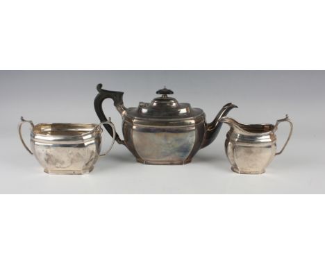 A George V silver cushion shaped three-piece tea set, comprising teapot, two-handled sugar bowl and milk jug, Sheffield 1928 