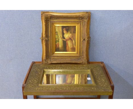 A brass framed mirror and a gilt framed print