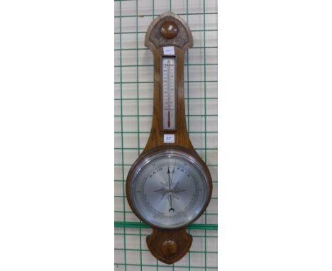 An oak aneroid barometer