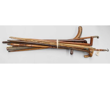 A Collection of 19th Century and Later Multi Purpose Walking Sticks and Canes, including horse measuring stick, bamboo pipe c