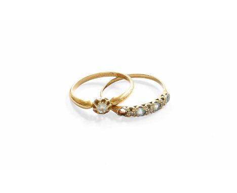 An 18 Carat Gold Diamond Solitaire Ring, finger size P; and A 9 Carat Gold Dress Ring, finger size T (a.f.)Solitaire - 2.4 gr