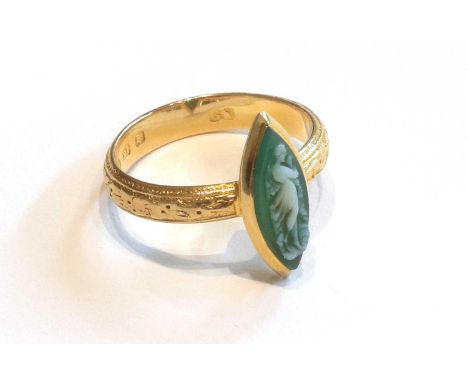 An 18 Carat Gold Cameo Ring, the green marquise shaped cameo depicting a classical maiden, on a textured band, finger size SG