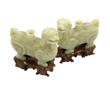 A Pair of Jade-Type Figural Incense Burners, in Archaic style, as standing lion dogs15cm long, on carved hardwood basesRight 