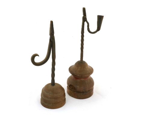 A Wrought Iron Rush Light Holder, late 18th/19th century, the hinged nips with monkey's tail terminal and wrythen stem, on a 
