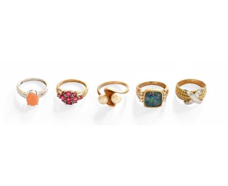 Four 9 Carat Gold Gem-Set Rings, including a ruby example, an opal triplet example, a crossover example etc; together with A 