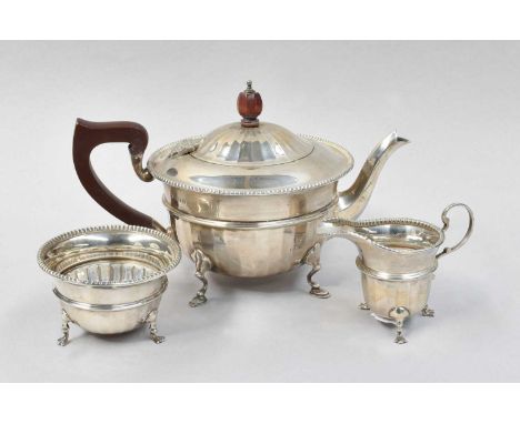 A Three-Piece George V Silver Tea-Service, by Adie Brothers Ltd., Birmingham, 1932, each piece tapering cylindrical and on th