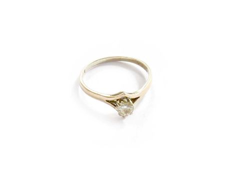 An 18 Carat Gold Diamond Solitaire Ring, the round brilliant cut diamond in a claw setting, to a forked shoulder plain polish