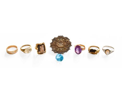 A Quantity of Jewellery, comprising of six rings of varying designs, including three 9 carat gold examples (tiger's-eye, smok