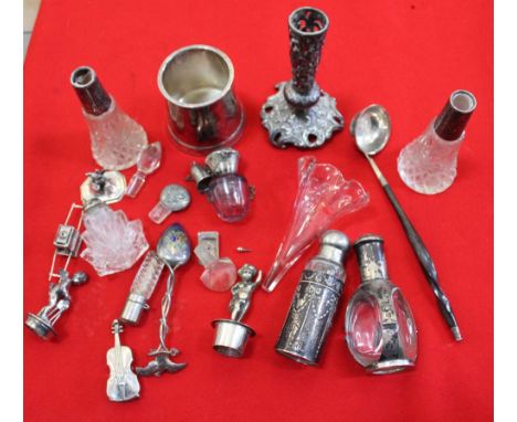 A collection of scent bottles, a "Geneve" spoon, twisted whale bone handle sauce ladle etc