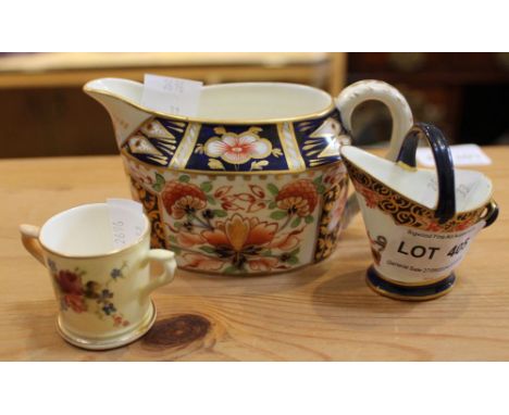 A Crown Derby cream jug, decorated in the Imari palette, together with a Royal Crown Derby "toy" in the form of a coal scuttl