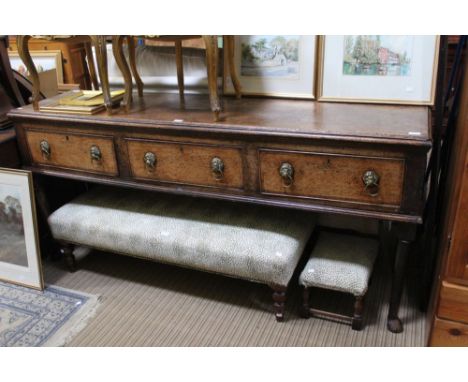 George III oak dresser base with three inline drawers, with brass lions head ring handles on fore pad feet supports, 188cm wi