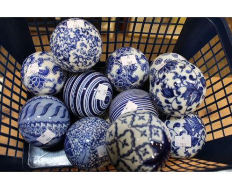11 blue and white ceramic carpet balls