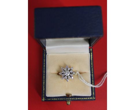 A diamond cluster ring, 18ct gold band, central stone considered to be in excess of a quarter of a carat, gross weight 4.5g, 