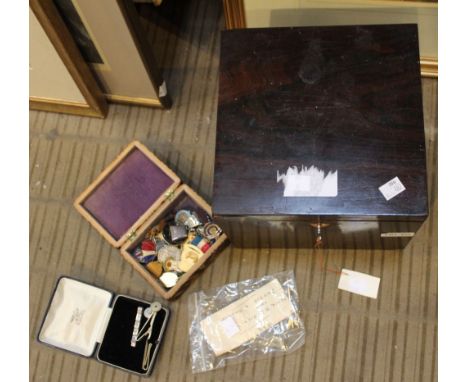A late 19th century rosewood box, containing a collection of medals and badges, two stick pins and an 1889 silver Crown