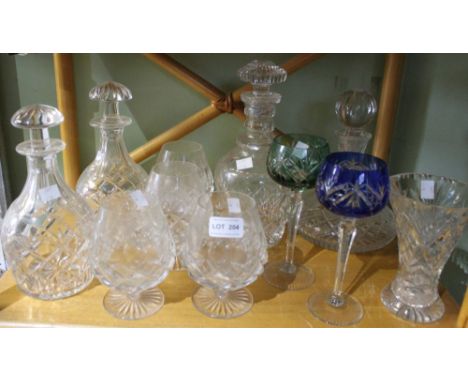 A set of four heavy cut glass brandy balloons, a ships decanter, and three others, two coloured bowl hocks&nbsp;