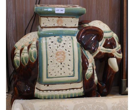 A pair of Oriental ceramic elephant garden seats Condition: some crazing, some manufacturing blemishes, overall okay.  