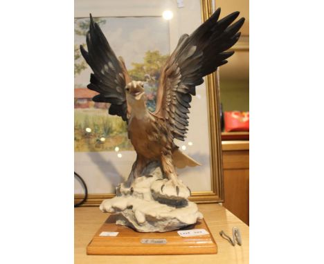 R Pennati - Florence 1984 a ceramic model of an Eagle on wooden plinth