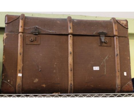 A large hessian and wood bound travelling trunk