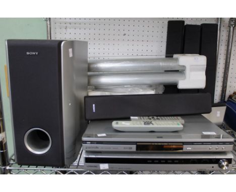 A shelf containing a selection of Hifi and video equipment to include speakers, players. Panasonic, Sony etc