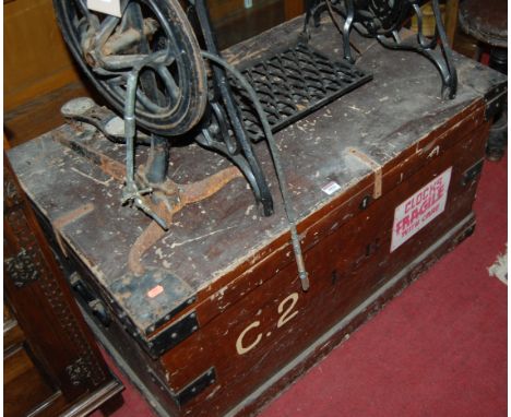 A late 19th century stained pine and metal bound hinged top military travelling trunk
Provenance: Rushbrooke Estate, Bury St 