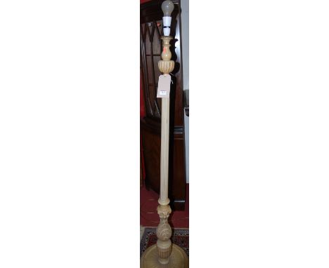 A cream painted standard lamp