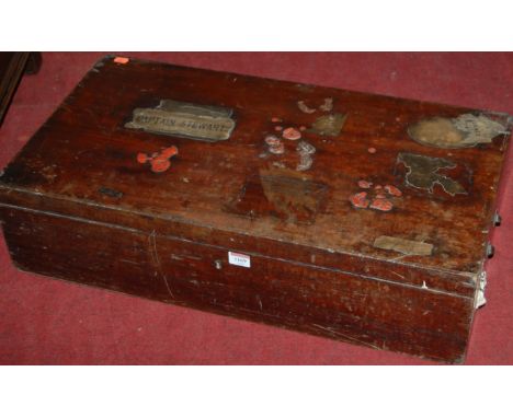 A 19th century mahogany hinge-top table-top trunk, having end carry handles 