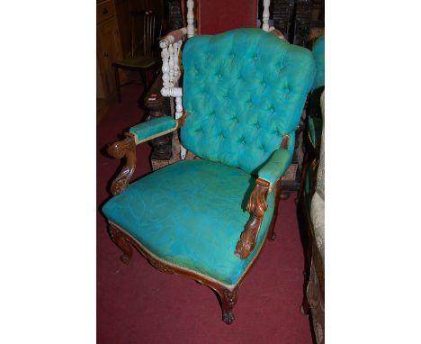 A pair of Louis XV style walnut framed and floral upholstered button back open armchairs, circa 1900