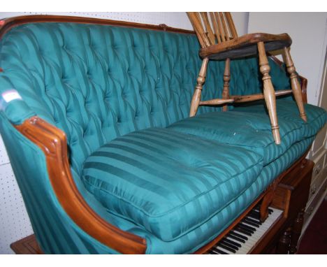 A Louis XV style green striped upholstered button back three seater canape