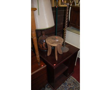 An African teak small stool, an enamelled metal table lamp, a copper pedestal bowl, a Victorian cast and enamelled iron lamp 