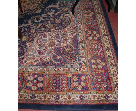 A Persian style machine woven woollen carpet 370x275cm