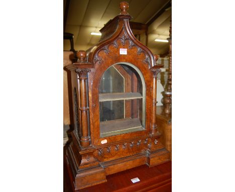 A Victorian figured walnut bracket clock case only, showing Gothic influence, having glazed door and back and fret carved sou