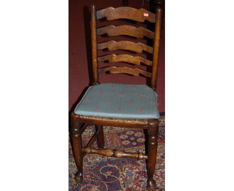 A set of four early 20th century oak ladder back and rush seat dining chairs, together with an oak barley twist open elbow ch