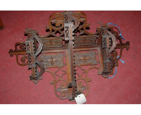 An Edwardian carved and pierced walnut three tier corner shelf (a/f)