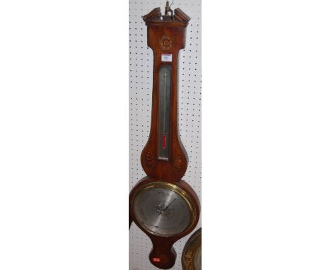 An early 19th century mahogany satinwood strung and conch shell inlaid two dial wheel barometer