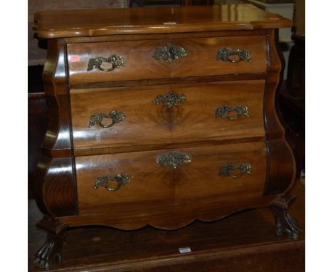 A Dutch walnut three drawer bombe commode, w.77cm Condition Report / Extra Information Structurally sound.
Drawers run well.
