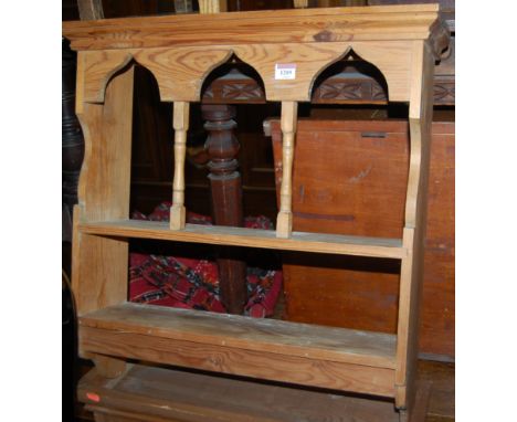 A modern pine two tier wall shelf, together with a further modern pine wall shelf (2)