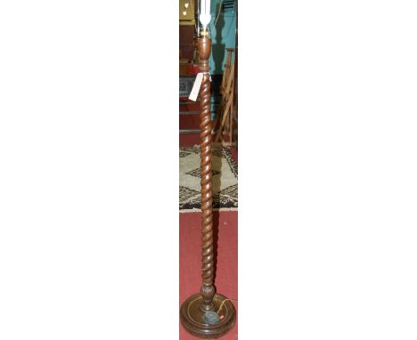 A walnut spiral turned standard lamp