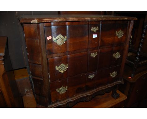 A Dutch walnut commode of shaped form and having three long drawers Condition Report / Extra Information w.83cm, d.51cm, h.79