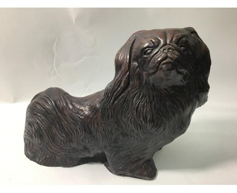 A large composite figure of a Pekingese, 35cm wide, together with an Oriental blue and white ginger jar and cover converted t