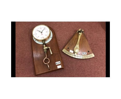 A ships clinometer with brass fittings to an oak back, from the bridge of HMS Cambria, paid off in May 1969, together with a 