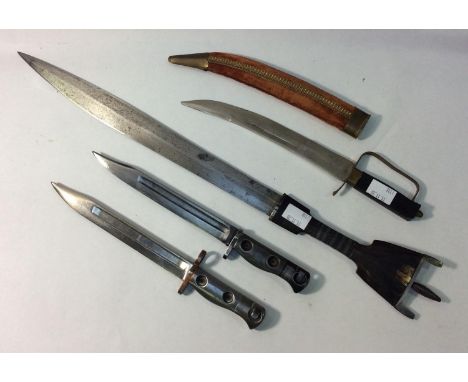 Two various British SLR bayonets, lacking scabbards, one stamped L.1.A3, together with an African Somalian Billao dagger with