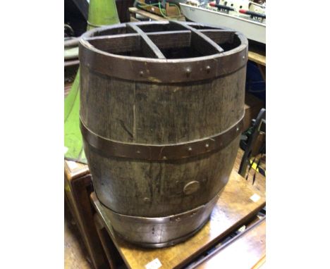 An oak and metal bound coopered barrel converted to a stick or umbrella stand, with compartmented top and internal metal drip