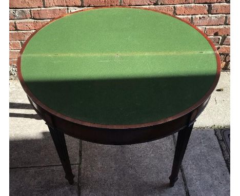 A nice quality mahogany folding demi-lune card table, with cross-banded top, green baize, beaded edge, raised on the stop-rea