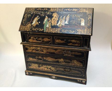 A miniature table-top black lacquered bureau, the entirety with gilt and painted chinoiserie decoration depicting figures, tr