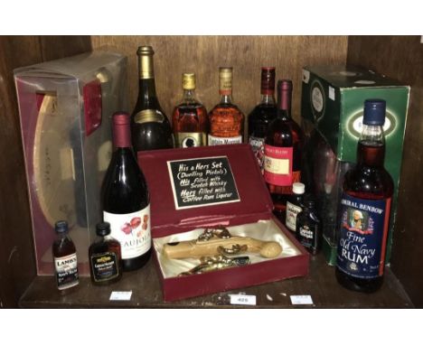 A small collection of assorted spirits comprising 1 litre bottles of Captain Morgan spiced and dark rum, a 1 litre Prince Cha
