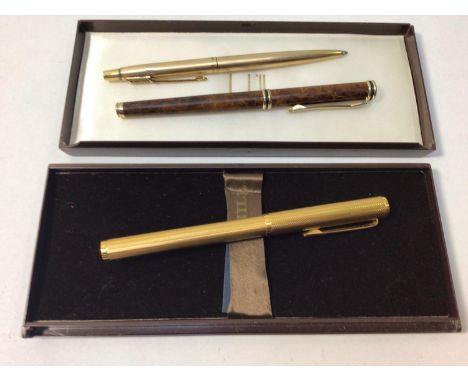 A Dunhill fountain pen with engine turned case, 14k gold nib marked '585', with Dunhill box, together with a Parker ballpoint